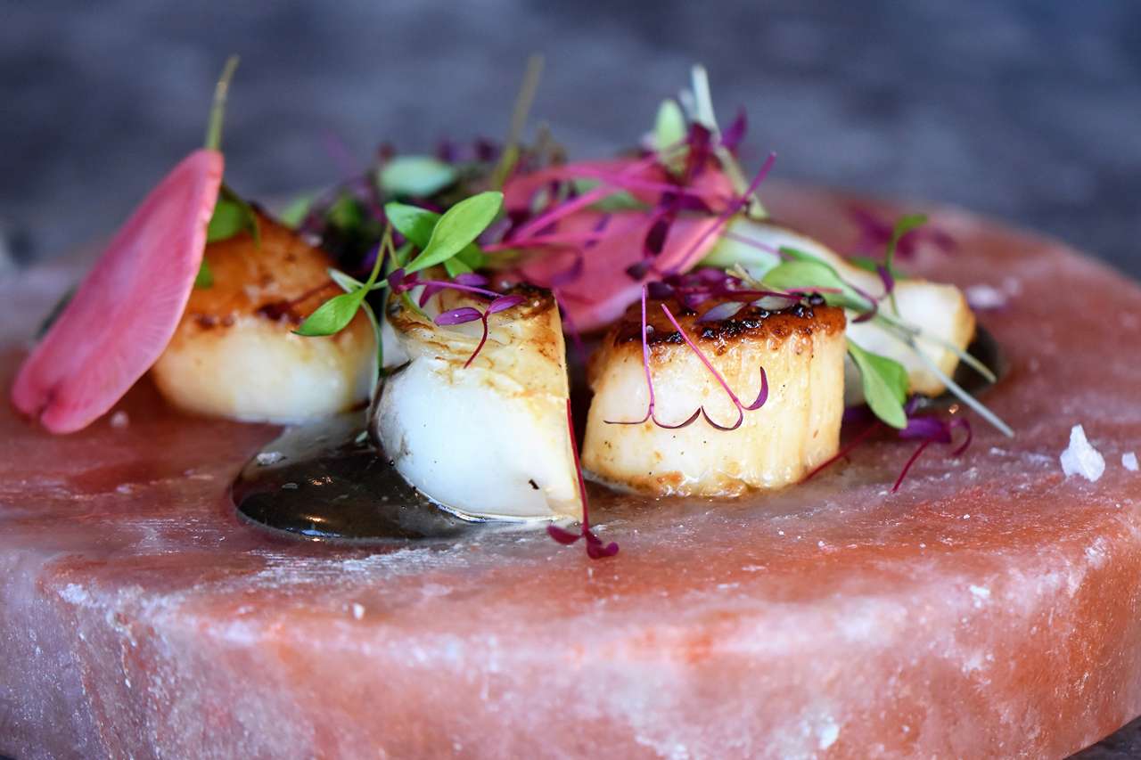 Himalayan Pink Salt Grilling plate with scallops and scallions for a sizzling treat